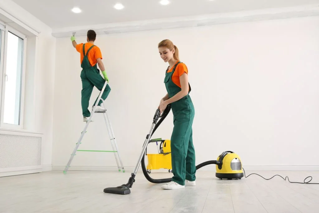 two professionals cleaning the house after construction